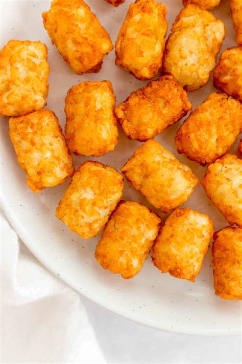 When you’re ready to get started, following these instructions to make this loaded tater tot recipe. Preheat the oven to 425 degrees F. Mix the sour cream, mayo, and ranch seasoning in a small bowl. Adjust flavor if needed with All-Purpose MSG Seasoning or salt and pepper. Set in the fridge until ready to serve.
